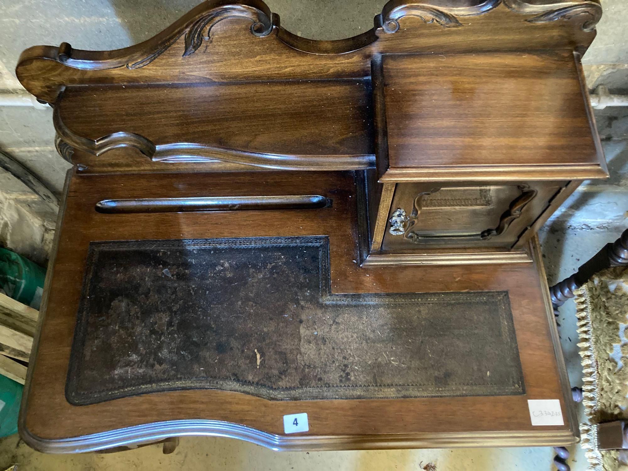 An early 20th century stained beech writing table, with raised superstructure, width 77cm height 108cm